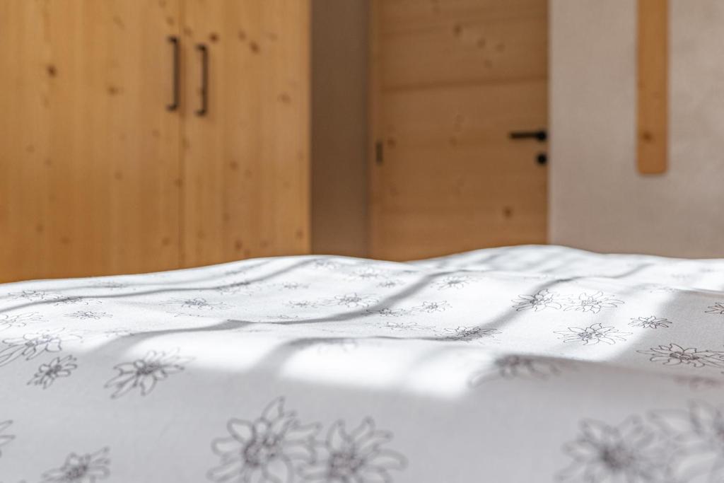 Posteľ alebo postele v izbe v ubytovaní Ciasa Iachin - Dolomites Dream Retreat