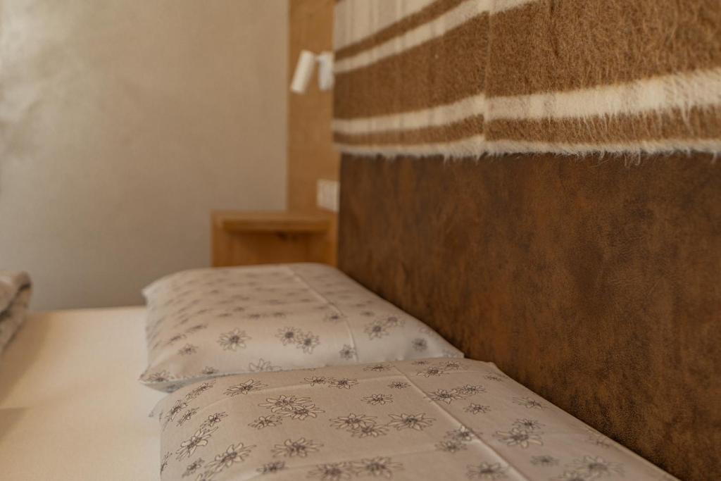 Posteľ alebo postele v izbe v ubytovaní Ciasa Iachin - Dolomites Dream Retreat