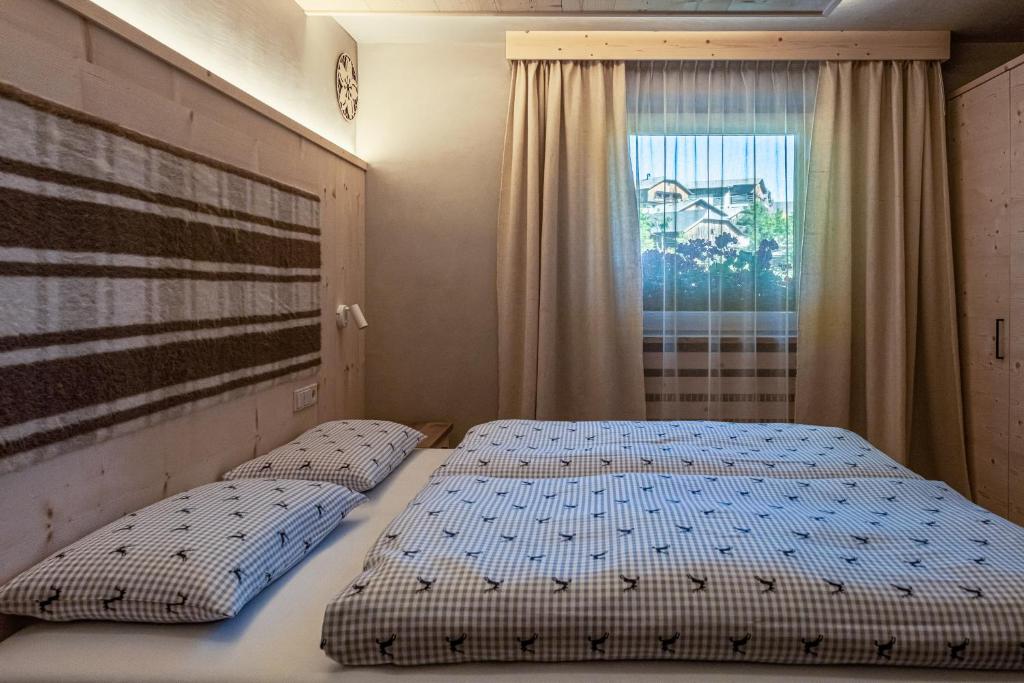 Posteľ alebo postele v izbe v ubytovaní Ciasa Iachin - Dolomites Dream Retreat