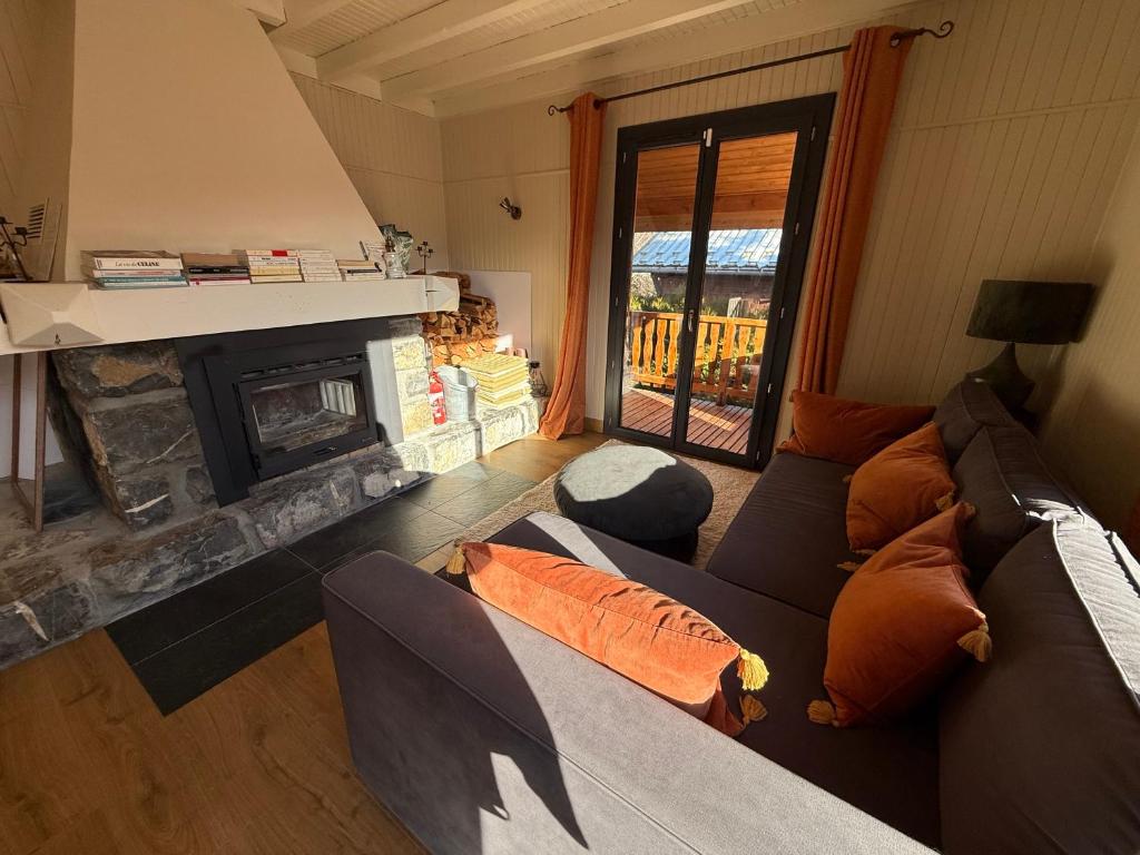 Posezení v ubytování Chalet avec Spa Magnifique vue