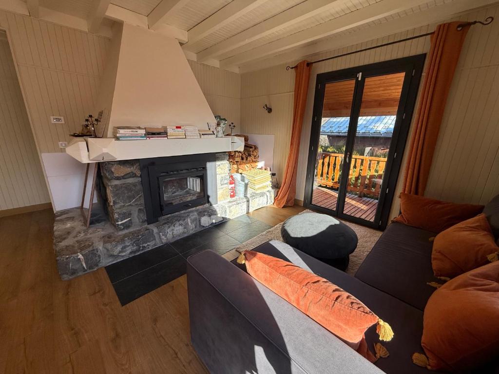 Posezení v ubytování Chalet avec Spa Magnifique vue