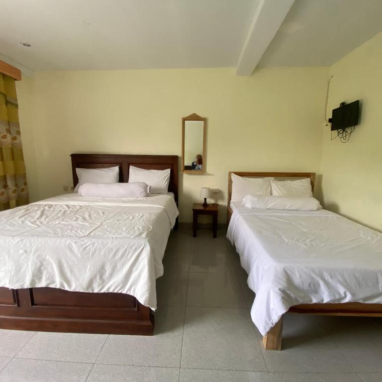 Postel nebo postele na pokoji v ubytování Pesona bali Room and restaurant