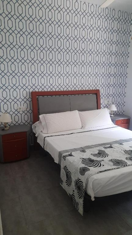 Postel nebo postele na pokoji v ubytování Chalet I con terraza en la playa