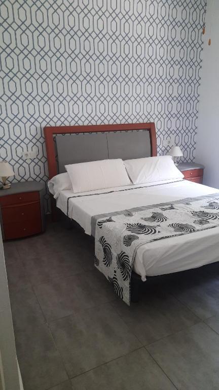 Postel nebo postele na pokoji v ubytování Chalet I con terraza en la playa