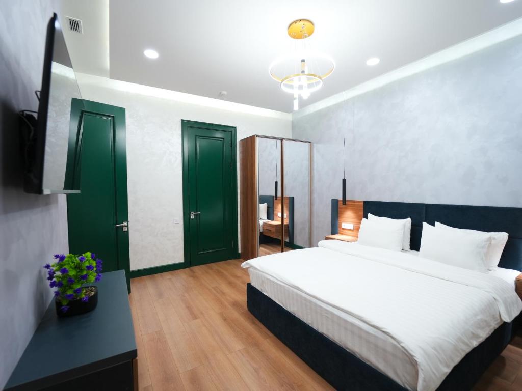 Katil atau katil-katil dalam bilik di Avant Hotel Tashkent Pool&Spa