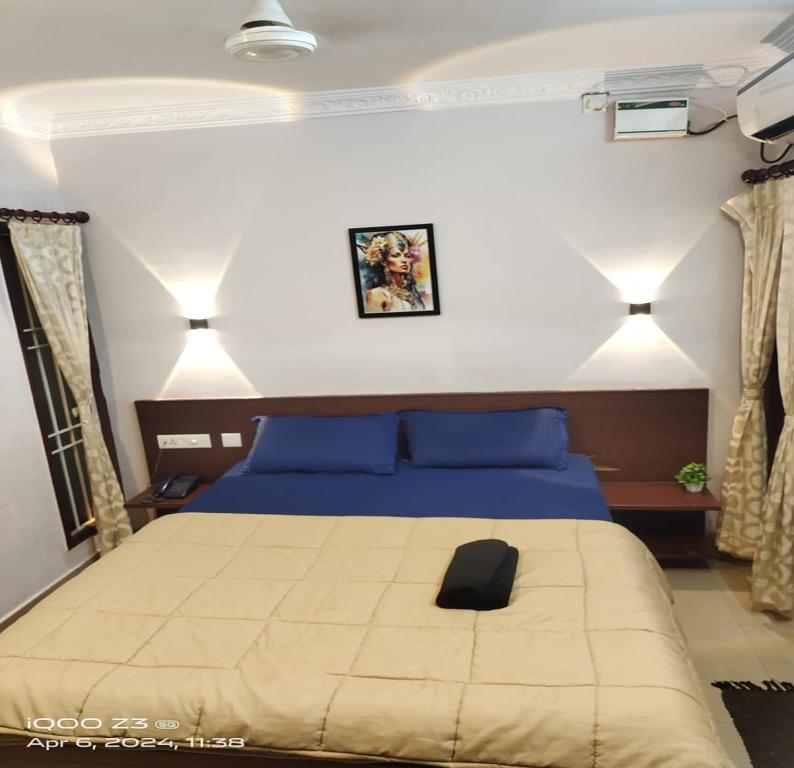 Postel nebo postele na pokoji v ubytování Nest Budget Inn