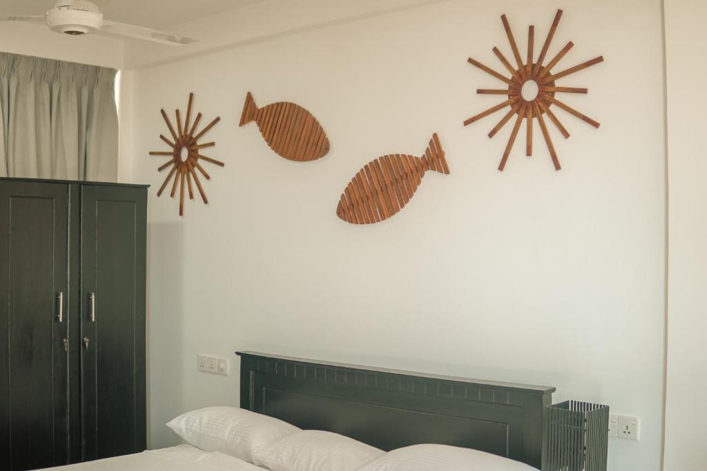 Letto o letti in una camera di R2 Guest - HIKKADUWA
