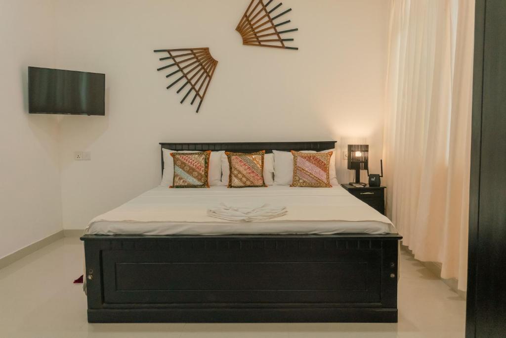 Letto o letti in una camera di R2 Guest - HIKKADUWA