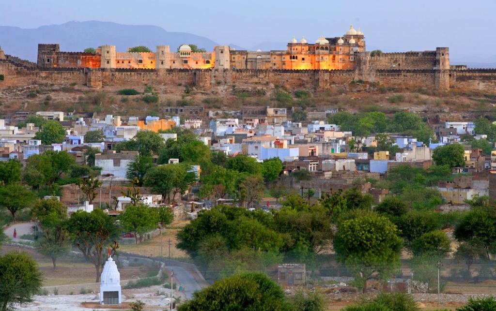 a view of a city with buildings in the background at Sardargarh Heritage Fort Udaipur in Sardārgarh