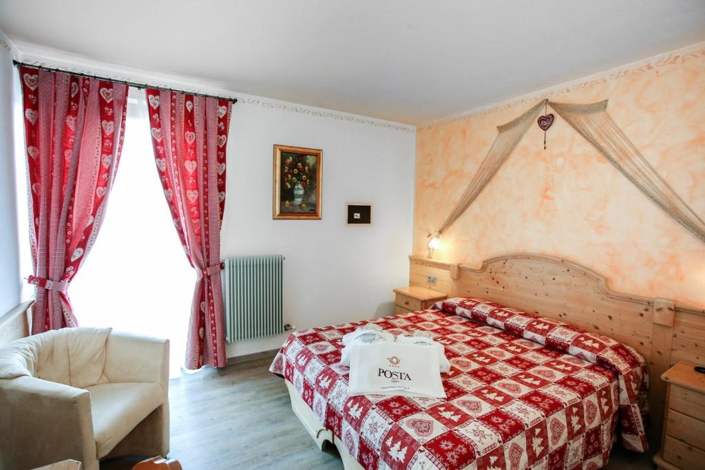 Ein Bett oder Betten in einem Zimmer der Unterkunft Al Posta Hotel 1899