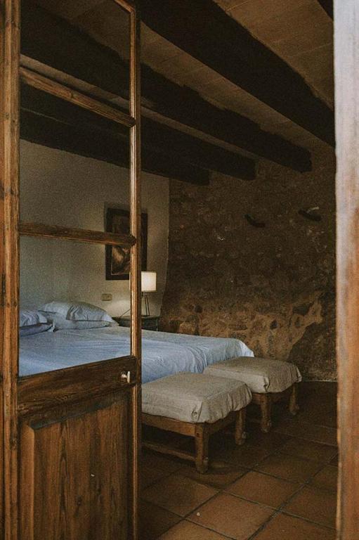 Postel nebo postele na pokoji v ubytování Agroturismo Can Torna AG178