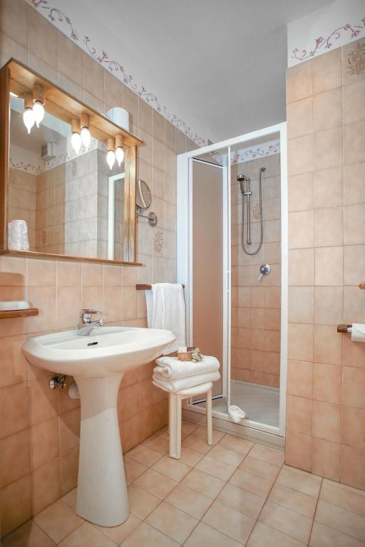 Ein Badezimmer in der Unterkunft Al Posta Hotel 1899