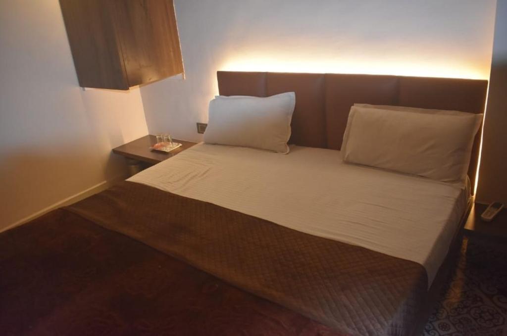Postel nebo postele na pokoji v ubytování Hotel Ten