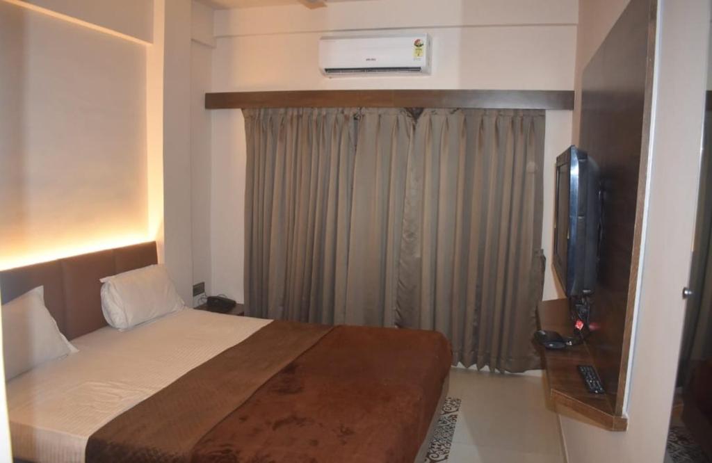 Postel nebo postele na pokoji v ubytování Hotel Ten