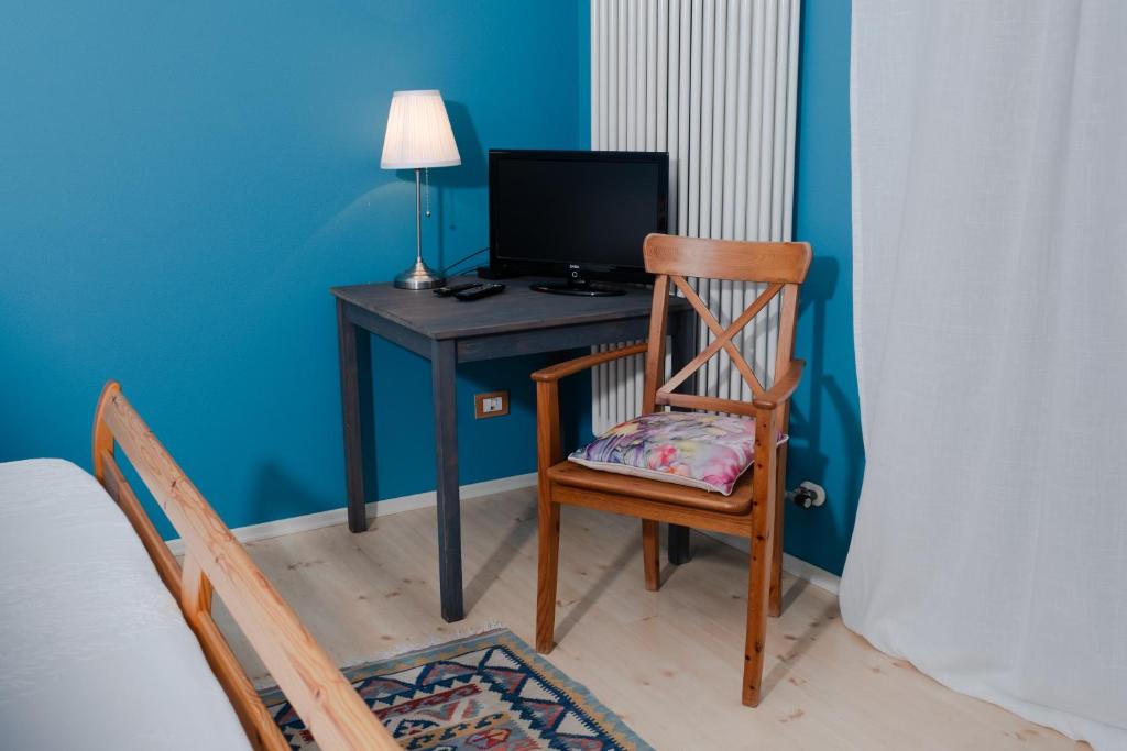 TV a/nebo společenská místnost v ubytování Rosa Tea B&B