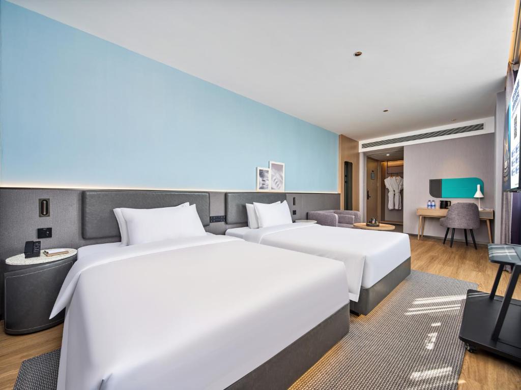 Cama o camas de una habitación en Country Inn&Suites By Radisson, Xi'an Bell and Drum Tower Flagship