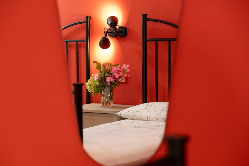 Postel nebo postele na pokoji v ubytování Rosa Tea B&B
