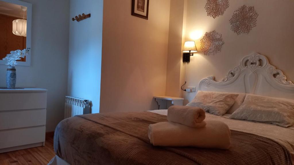 Postel nebo postele na pokoji v ubytování Pyros de Benás