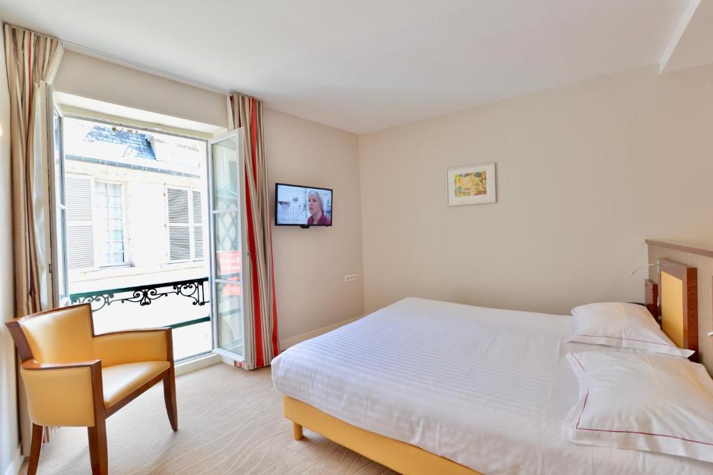 Postel nebo postele na pokoji v ubytování Best Western Plus Hôtel D'Angleterre