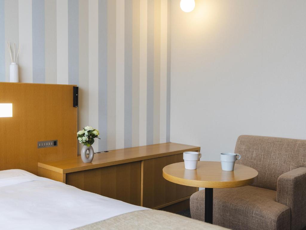 Postel nebo postele na pokoji v ubytování Hiroshima Washington Hotel