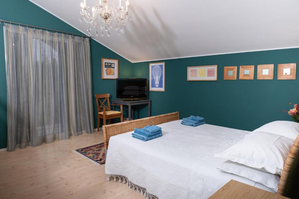 Postel nebo postele na pokoji v ubytování Rosa Tea B&B