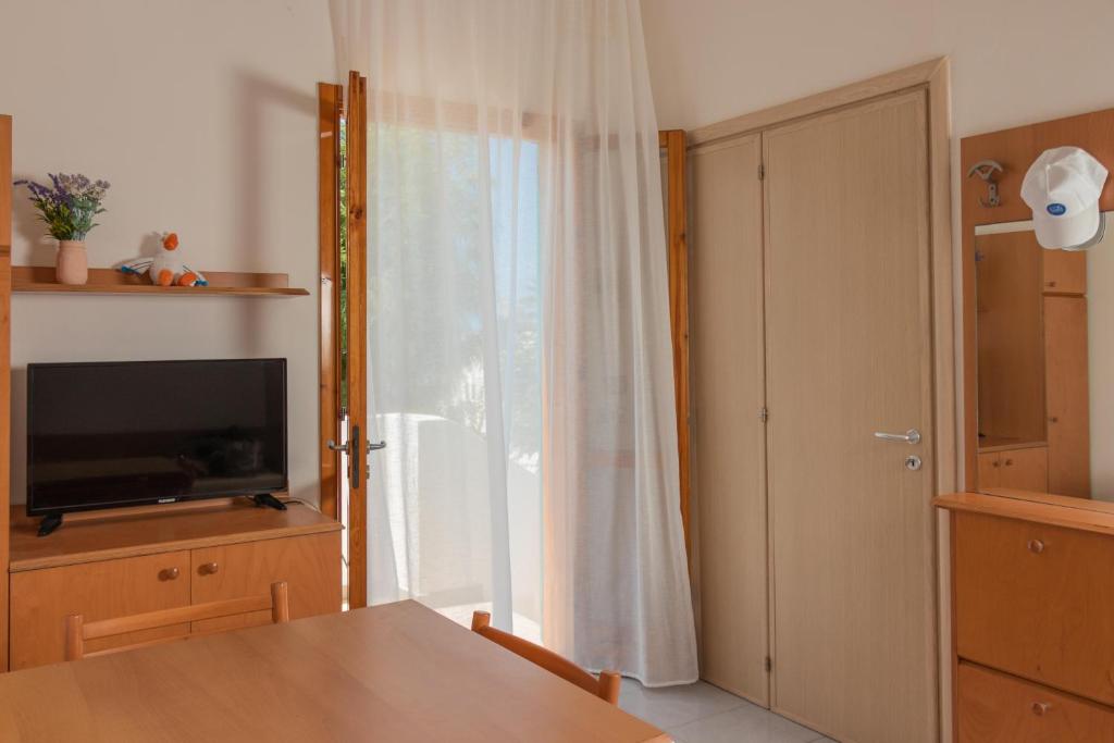 TV a/nebo společenská místnost v ubytování Costa del Salento - CDSHotels
