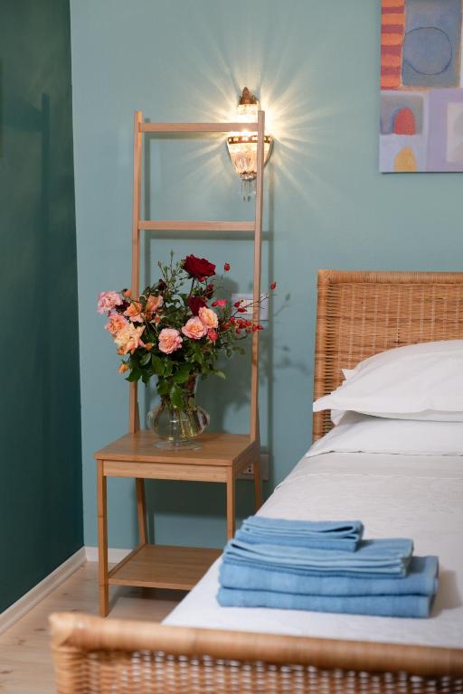 Postel nebo postele na pokoji v ubytování Rosa Tea B&B