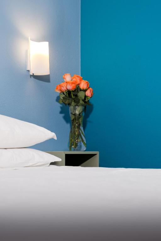 Postel nebo postele na pokoji v ubytování Rosa Tea B&B