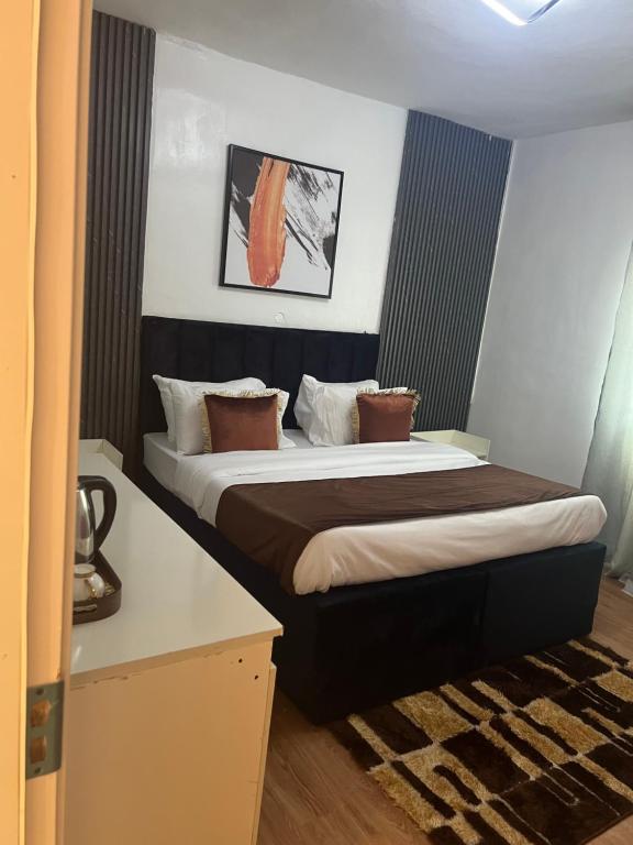 Postel nebo postele na pokoji v ubytování Florence Hotel and suites