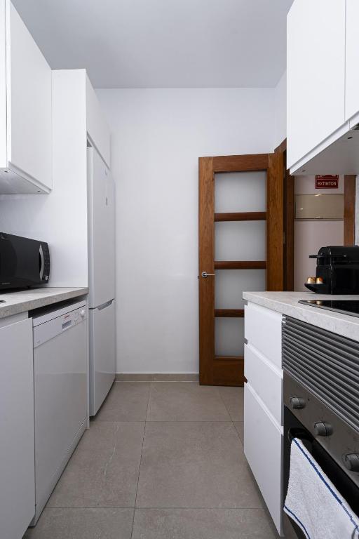Kuchyň nebo kuchyňský kout v ubytování Madrid Centric Suites