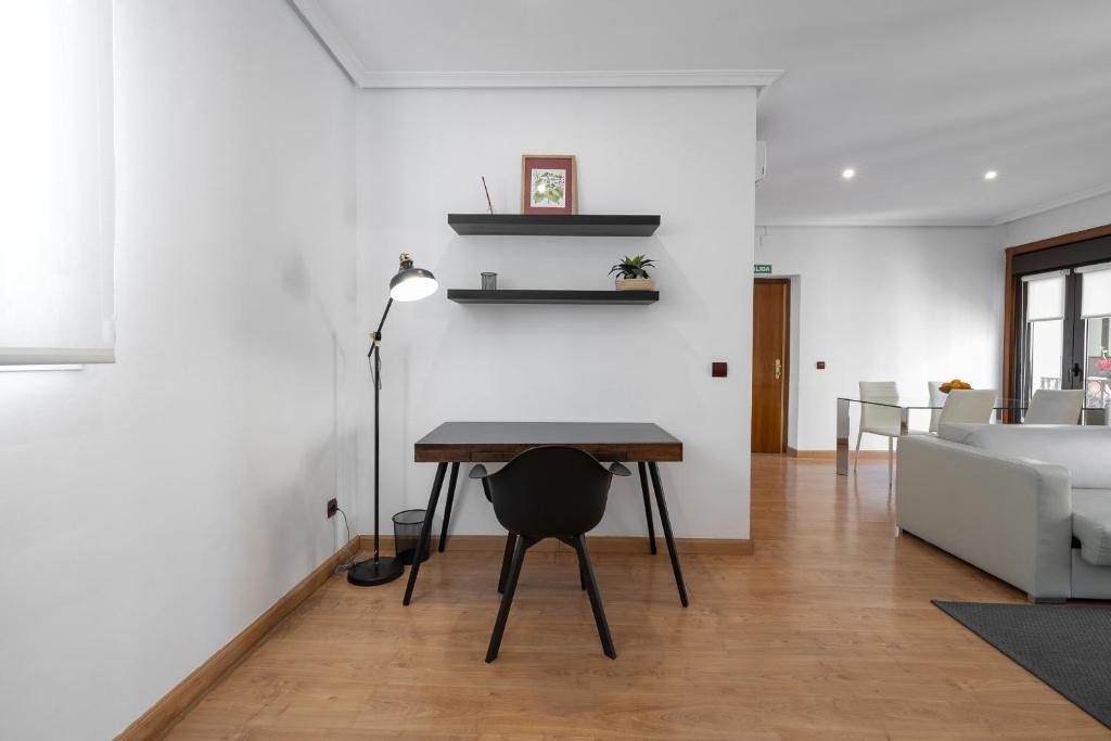 Postel nebo postele na pokoji v ubytování Madrid Centric Suites