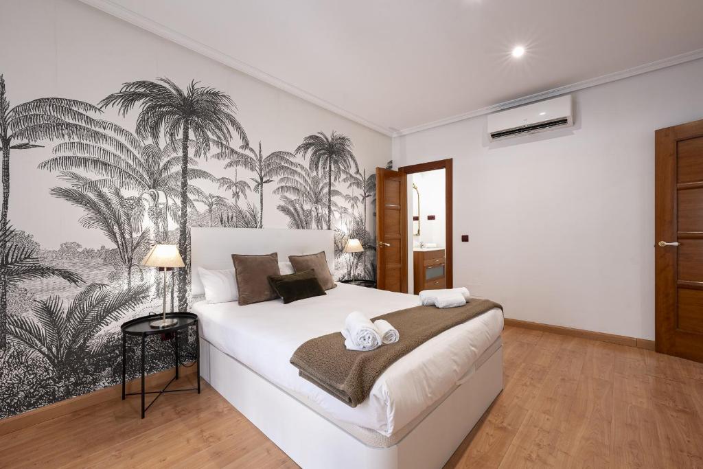 Postel nebo postele na pokoji v ubytování Madrid Centric Suites