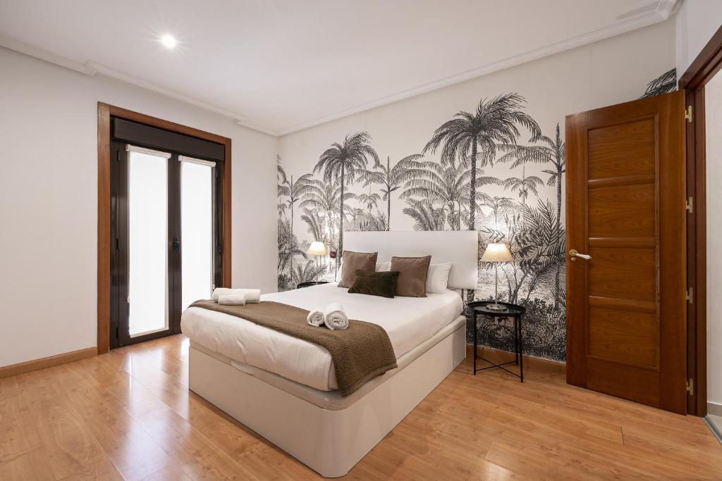 Postel nebo postele na pokoji v ubytování Madrid Centric Suites