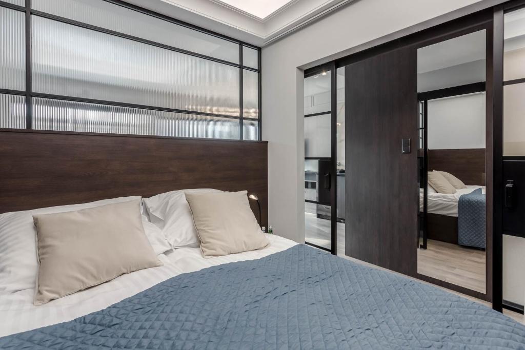 Posteľ alebo postele v izbe v ubytovaní Rent like home - Apartamenty w Deo Plaza