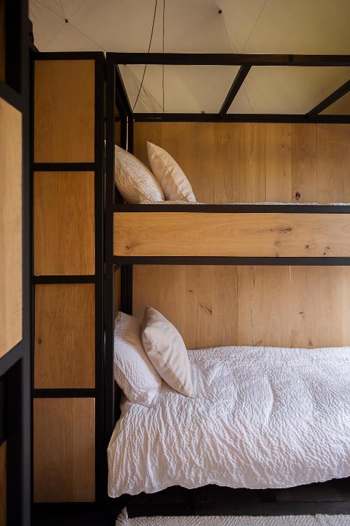 Postel nebo postele na pokoji v ubytování Crossover lodge de la vallée