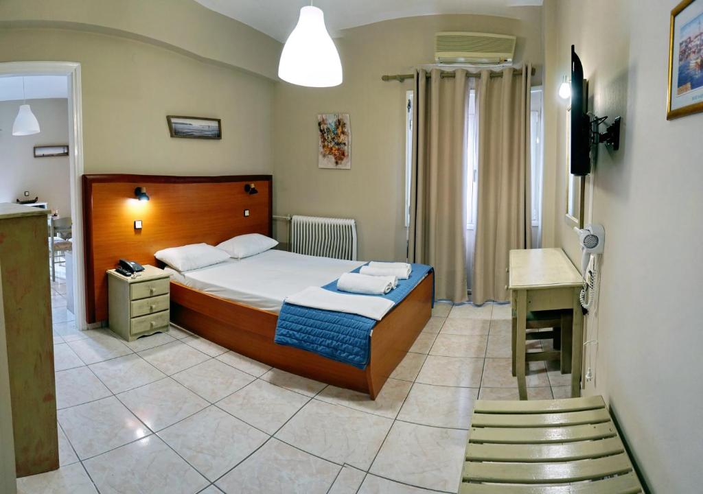 Postel nebo postele na pokoji v ubytování Sourada Studios