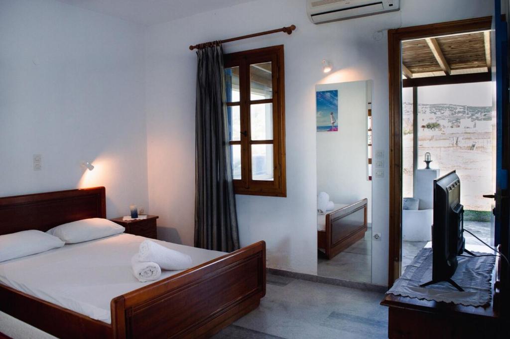 A bed or beds in a room at Moonlight Kastraki beach house
