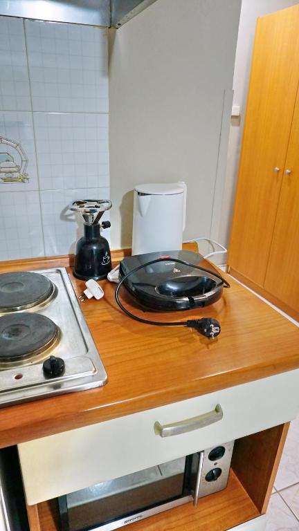 Kuchyň nebo kuchyňský kout v ubytování Sourada Studios