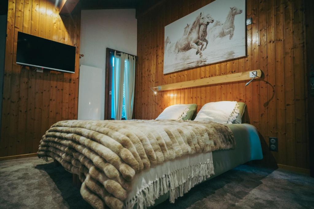 Postel nebo postele na pokoji v ubytování Auberge chez Mado et Augusta