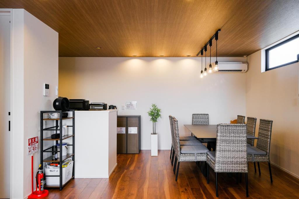 a dining room with a table and chairs at MIRATIO Sirius in Onna