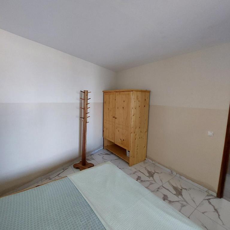 Postel nebo postele na pokoji v ubytování Oia Mindelo Chambre d'hotes