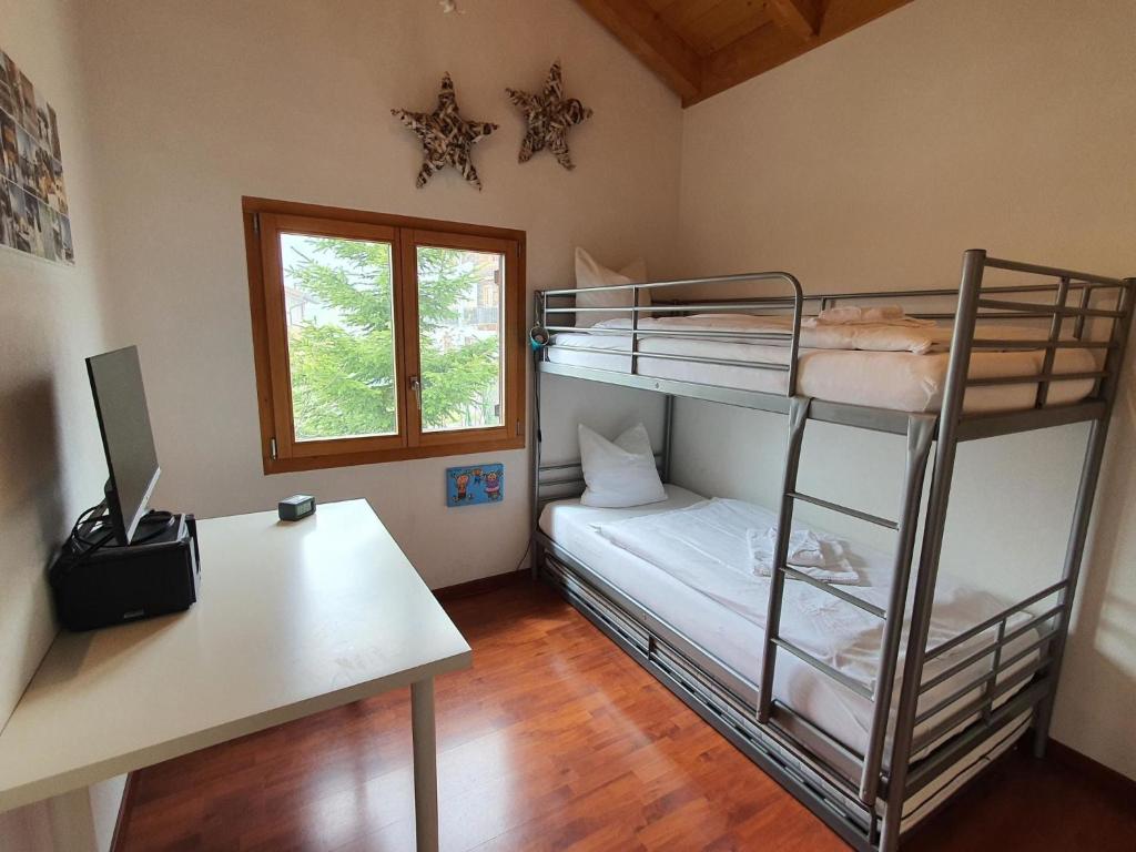 Postel nebo postele na pokoji v ubytování Apartment Tgesa Grischa by Interhome