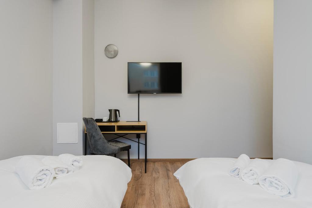 Postel nebo postele na pokoji v ubytování Hala Hostel - Pokoje na wyłączność tuż przy Dworcu Gdynia