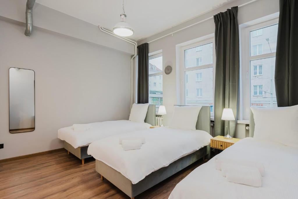 Postel nebo postele na pokoji v ubytování Hala Hostel - Pokoje na wyłączność tuż przy Dworcu Gdynia