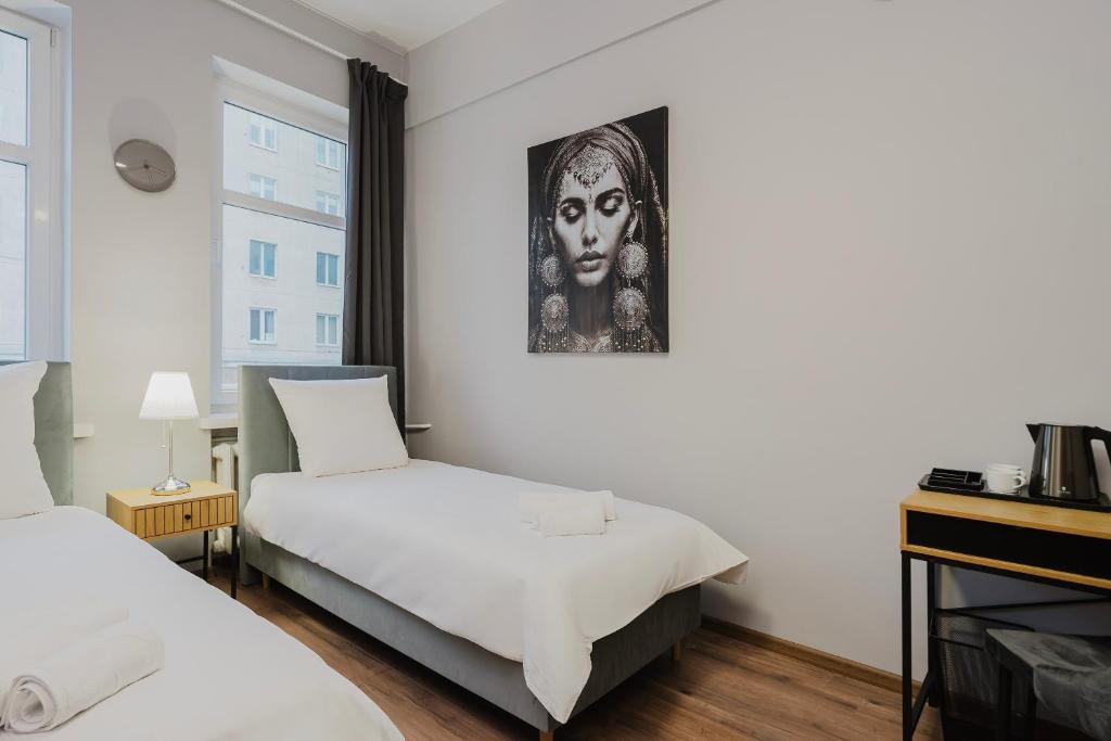 Postel nebo postele na pokoji v ubytování Hala Hostel - Pokoje na wyłączność tuż przy Dworcu Gdynia