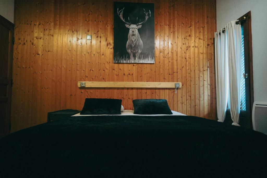 Postel nebo postele na pokoji v ubytování Auberge chez Mado et Augusta