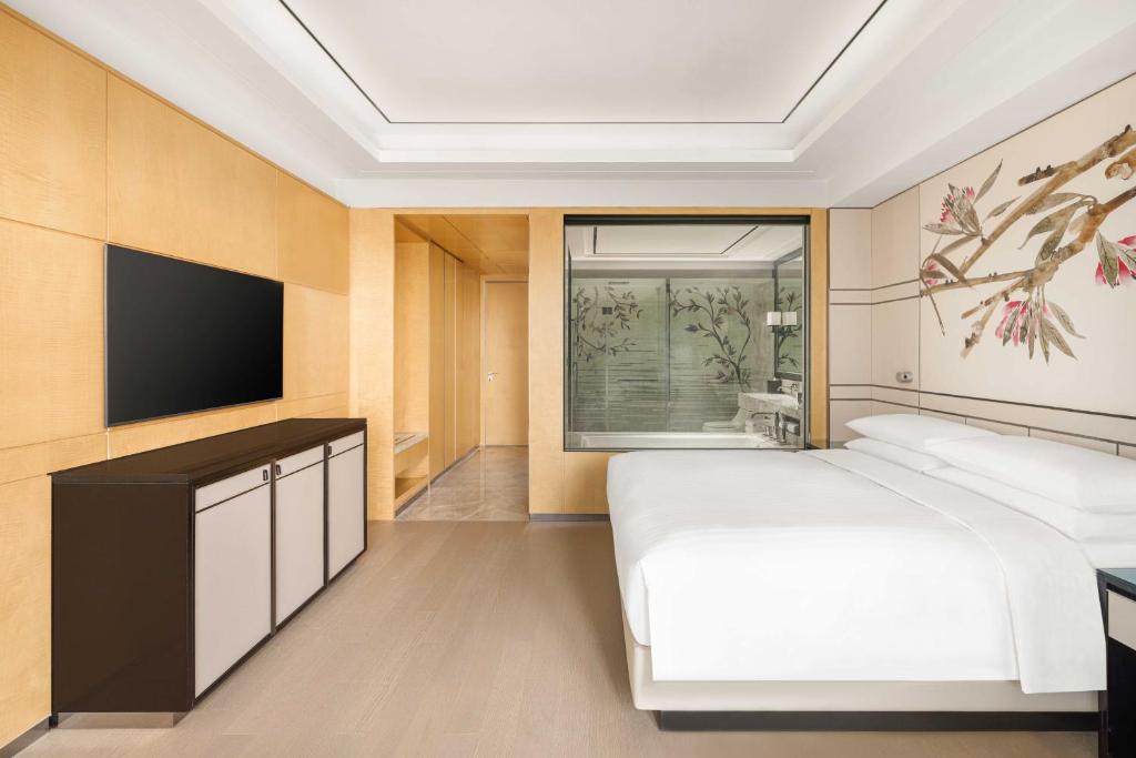 Postel nebo postele na pokoji v ubytování Shanghai Marriott Hotel Parkview
