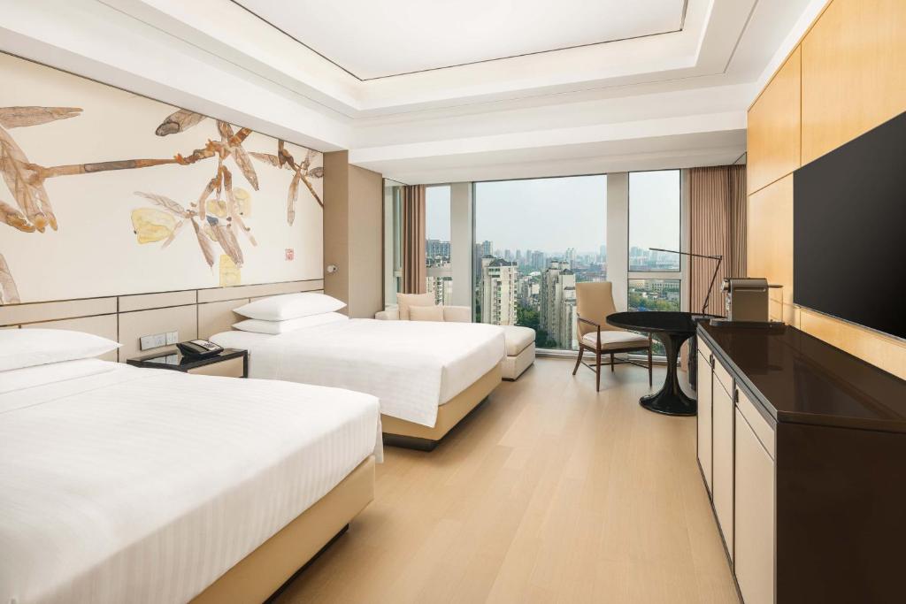 Postel nebo postele na pokoji v ubytování Shanghai Marriott Hotel Parkview