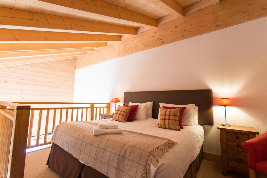 Postel nebo postele na pokoji v ubytování Mountain Lodge, Les Crosets