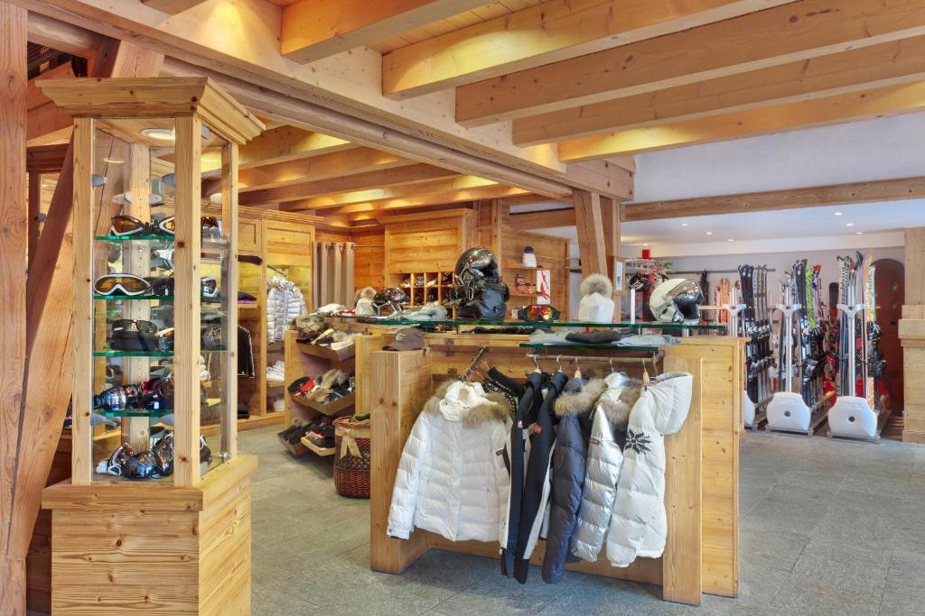 a room filled with lots of shoes and ski equipment at Hôtel Les Barmes De l'Ours in Val-d'Isère